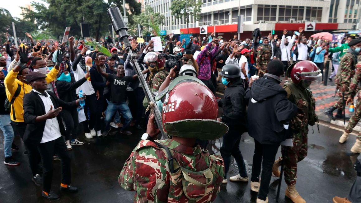 A police officer aims a gun loaded with a tear gas canister towards demonstrators along Kenyatta Avenue in Nairobi, Kenya on June 20,2024 during protests against the proposed Finance Bill 2024. PHOTO | FILE | NMG