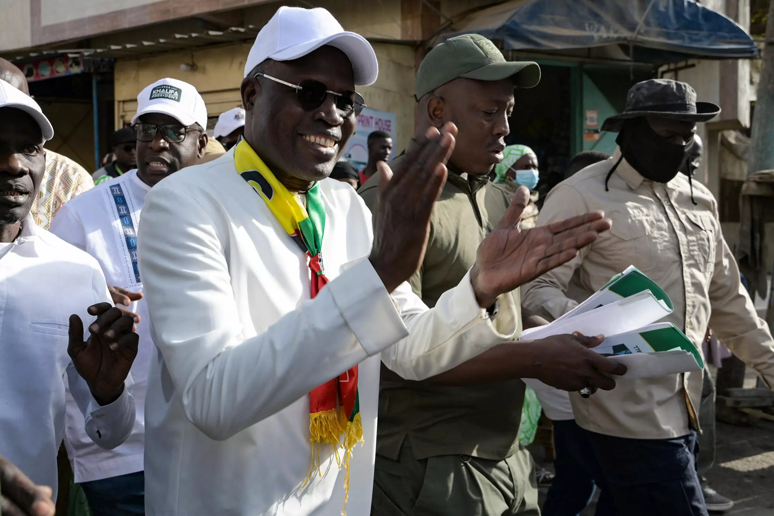 Presidential candidate Khalifa Sall greets supporters during a tour of several areas in Senegal’s capital Dakar on March 9, 2024. © Seyllou, AFP