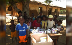 Dr Mamy Andrianirina Rakotondratsara (centre) distributing antimalarials in rural Madagascar.